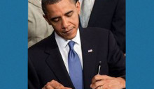 Obama signing healthcare bill