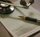 Doctor's script with pen and scope