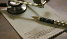 Doctor's script with pen and scope