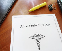 Affordable Care Act document on an office desk