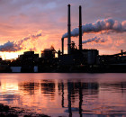 landscape photo of factory whith smoke stacks