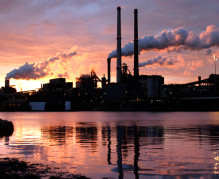landscape photo of factory whith smoke stacks